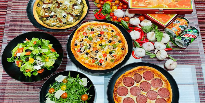 Up to 3 pizzas with soft beverages & salad