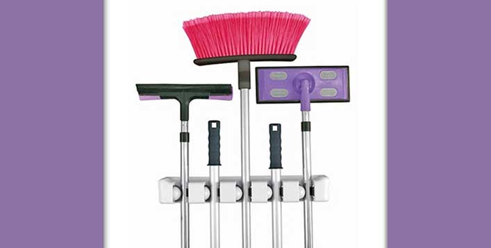 Conveniently holds mops, brooms & dust pans
